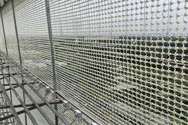 Close-up of transparent LED mesh on a glass facade
